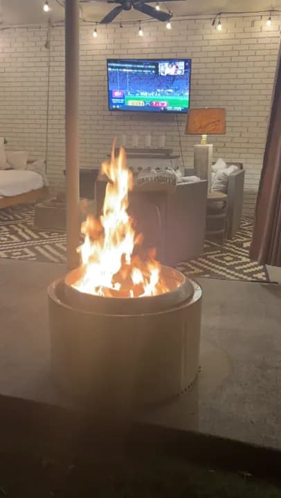 A Solo Stove fire pit burning Ember Prime firewood on a patio