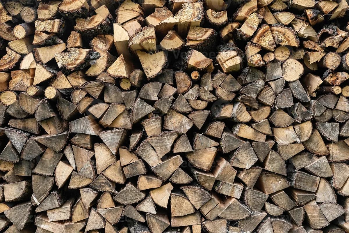 A stacked wall of split firewood