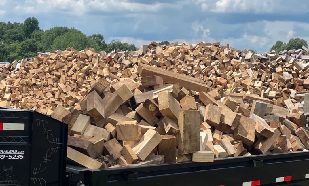 Massive pile of cut and split timber blocks ready for processing